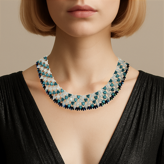 Necklace with blue and clear triangular beads worn by a model against a neutral background