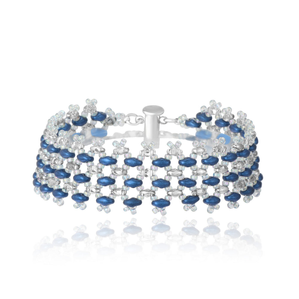 Handwoven bracelet with sapphire blue and clear crystal glass beads in a geometric openwork pattern, shown on white background