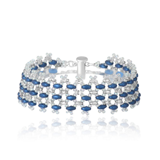 Handwoven bracelet with sapphire blue and clear crystal glass beads in a geometric openwork pattern, shown on white background