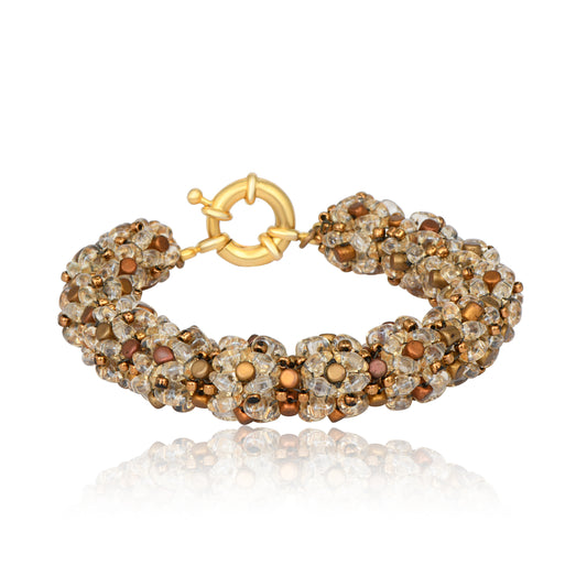 Handmade bracelet with honey, bronze, and gold glass beads in a rich floral beaded texture, shown on white background
